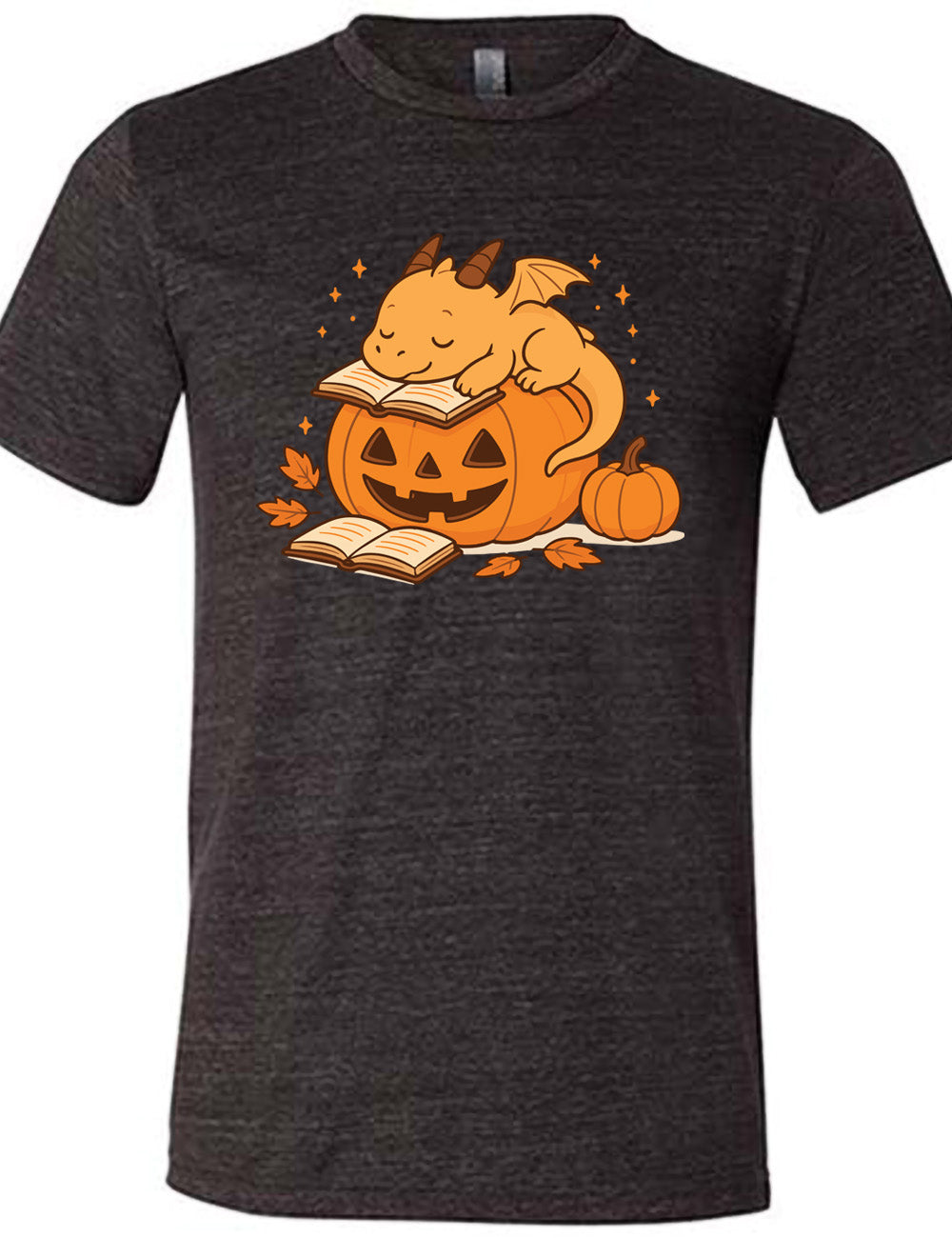 black unisex tee with the graphic of a cartoon-style dragon sleeping, with its head in its open book, on top of a jack-o-lantern, with another open book and small pumpkin next to all this, and a scattering of stars, and a few leaves