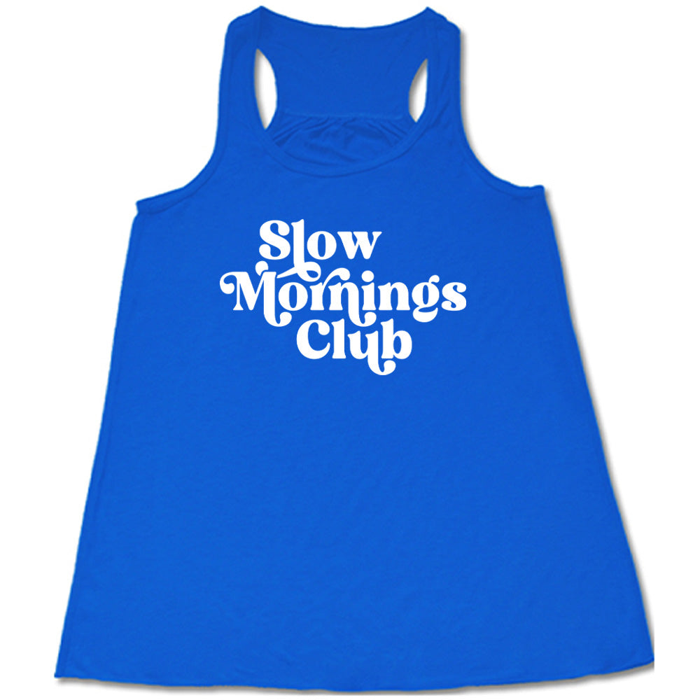 Blue colored flowy tank with a graphic on it that says "Slow Mornings Club" 