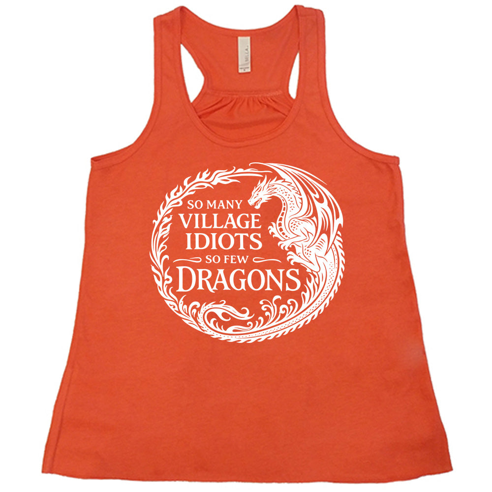 coral racerback tank with the graphic of a dragon, creating a circle from its tail plus flames, and the words "so many village idiots so few dragons" written within it