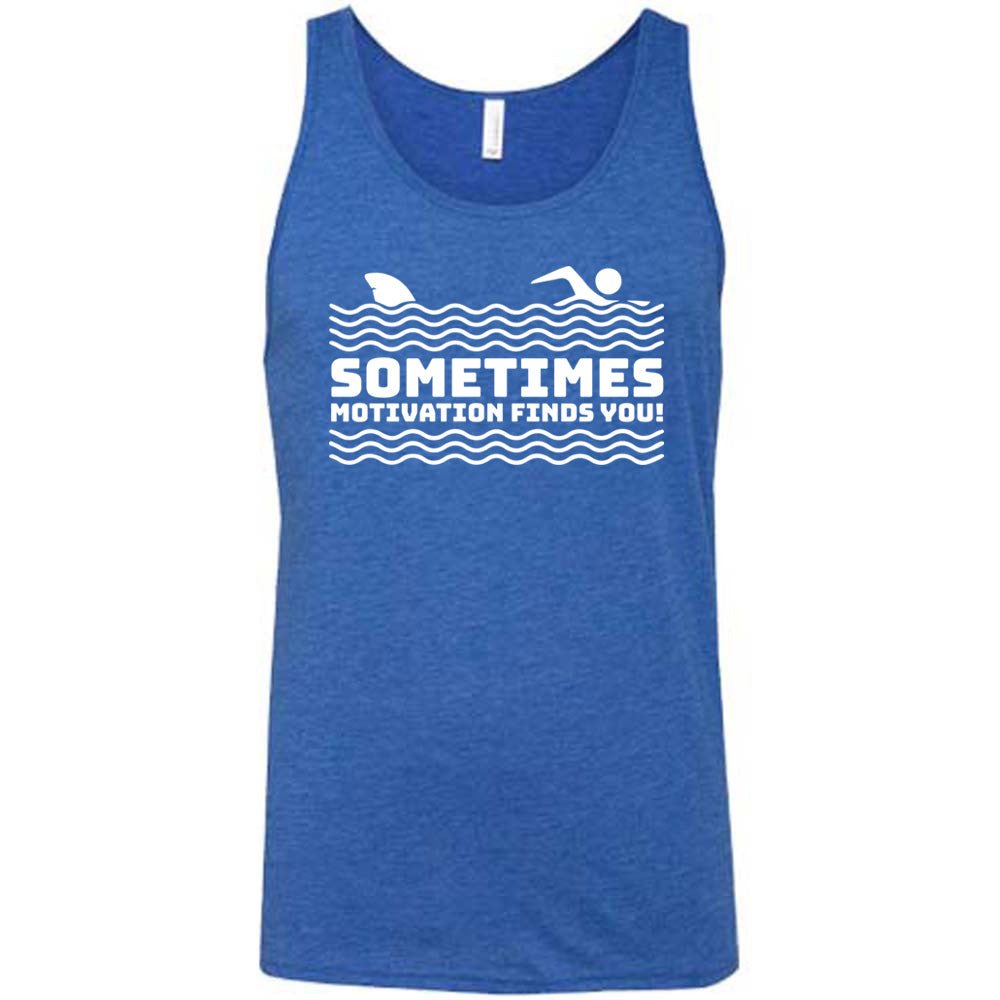 blue unisex tank with the words "sometimes motivation finds you!" in between the lined graphic of waves of the sea, and on top of the waves is the graphic of a figure swimming away from a fin in the water behind