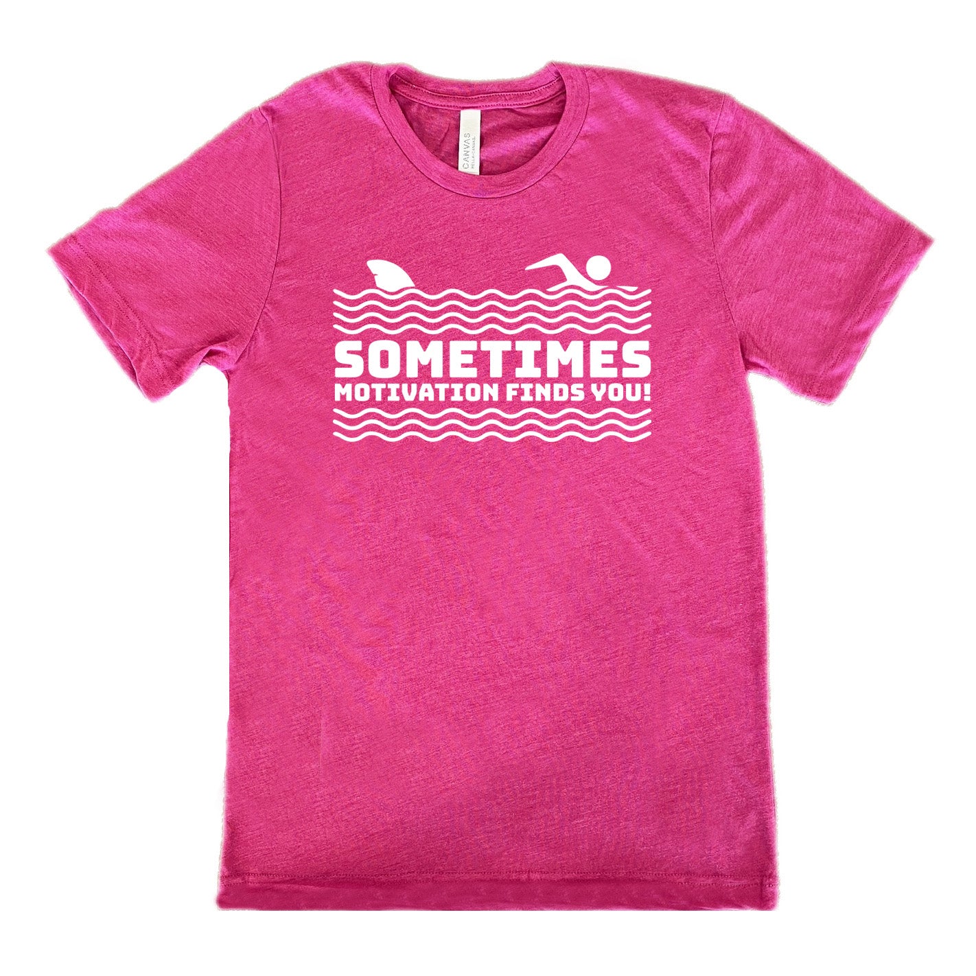 berry unisex tee with the words "sometimes motivation finds you!" in between the lined graphic of waves of the sea, and on top of the waves is the graphic of a figure swimming away from a fin in the water behind