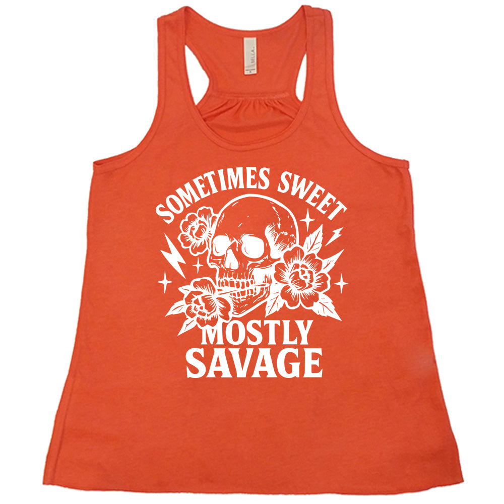 coral flowy tank with the words "sometimes sweet mostly savage on it with the graphic of a skull holding a flower between its teeth, with a couple flowers and a few stars and lightening bolts around it