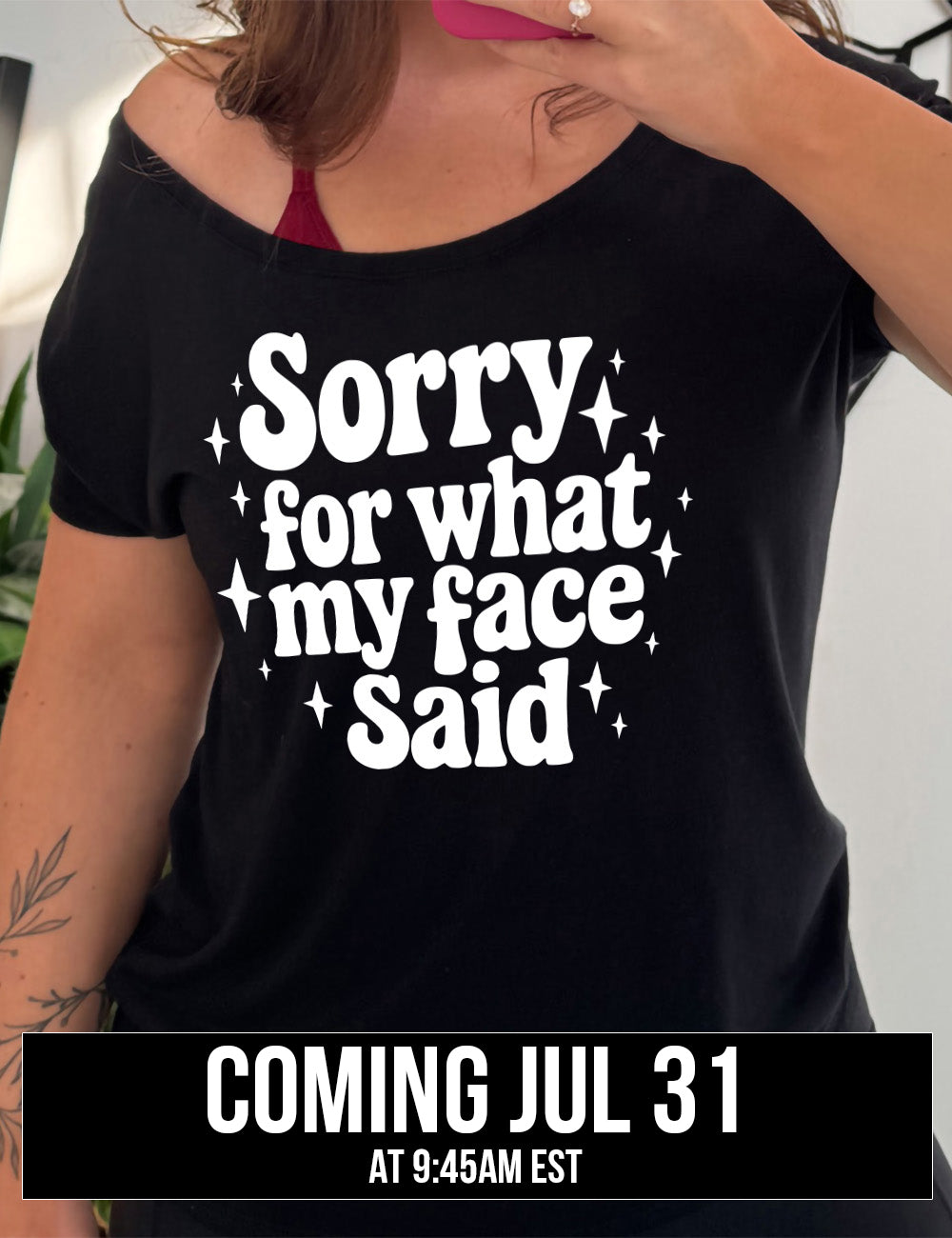 black slouchy tee with the words, surrounded by stars, saying " sorry for what my face said", coming july 31st