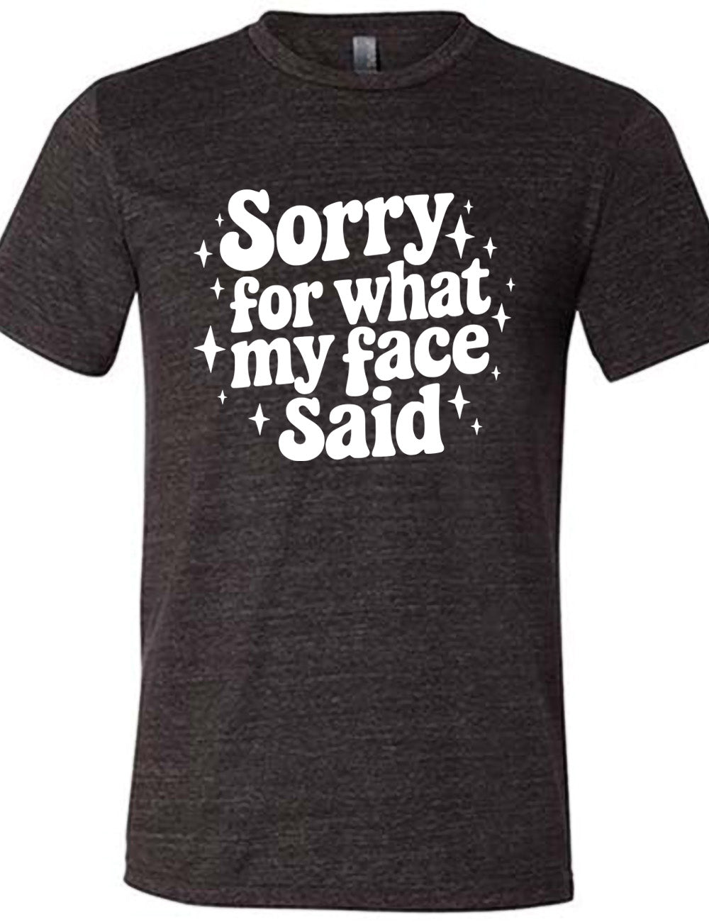 black unisex tee with the words, surrounded by stars, saying " sorry for what my face said" 