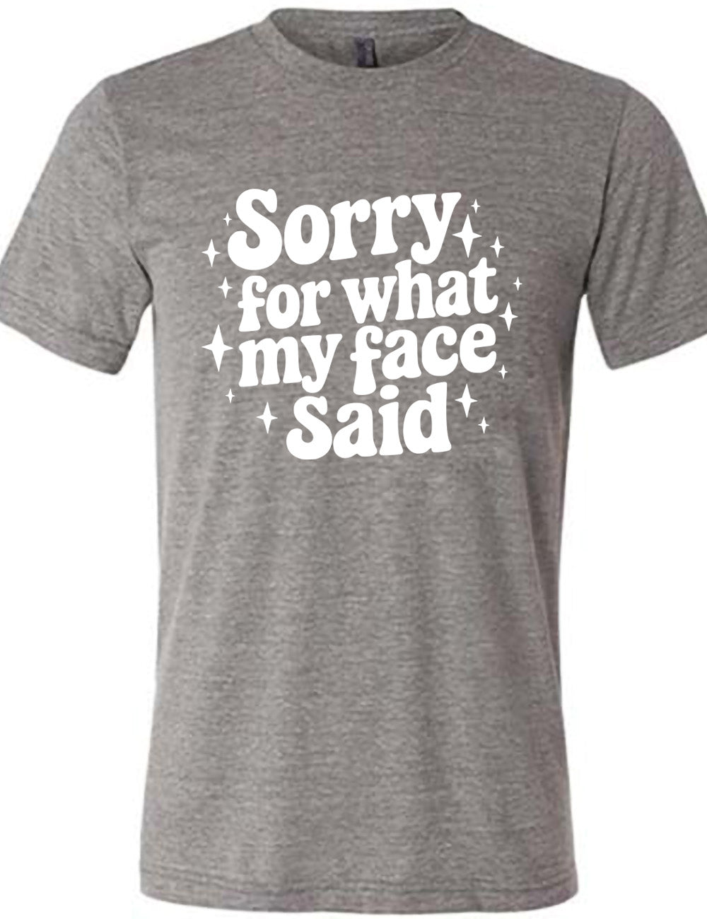 grey unisex tee with the words, surrounded by stars, saying " sorry for what my face said" 