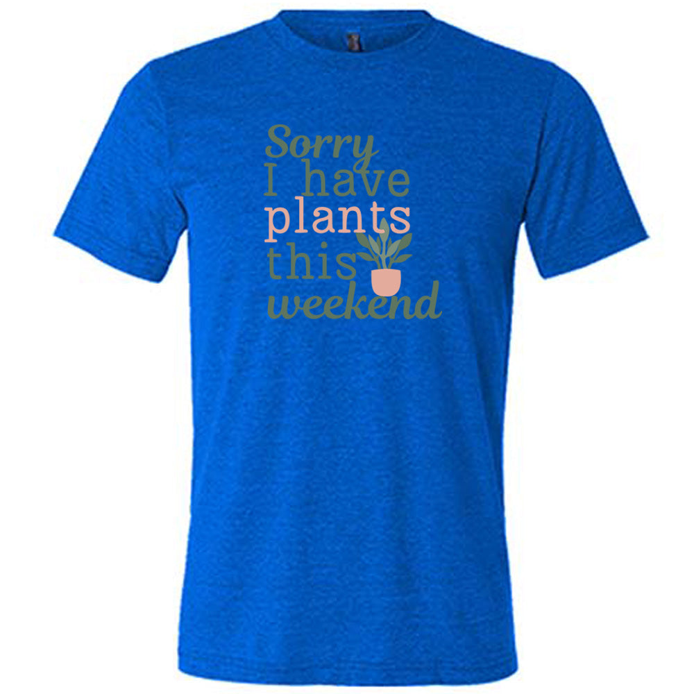 Blue colored shirt with a potted plant graphic on it that says "Sorry I Have Plants This Weekend"