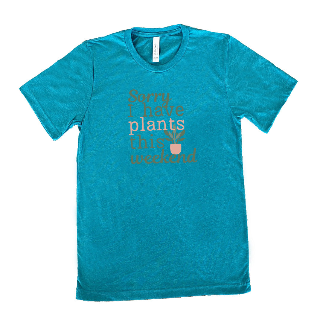 Teal colored shirt with a potted plant graphic on it that says "Sorry I Have Plants This Weekend"
