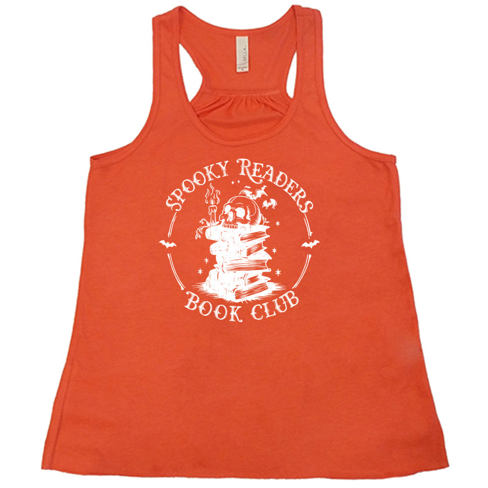Coral colored flowy tank with skull on a stack of books graphic on it that says "Spooky Readers Book Club"
