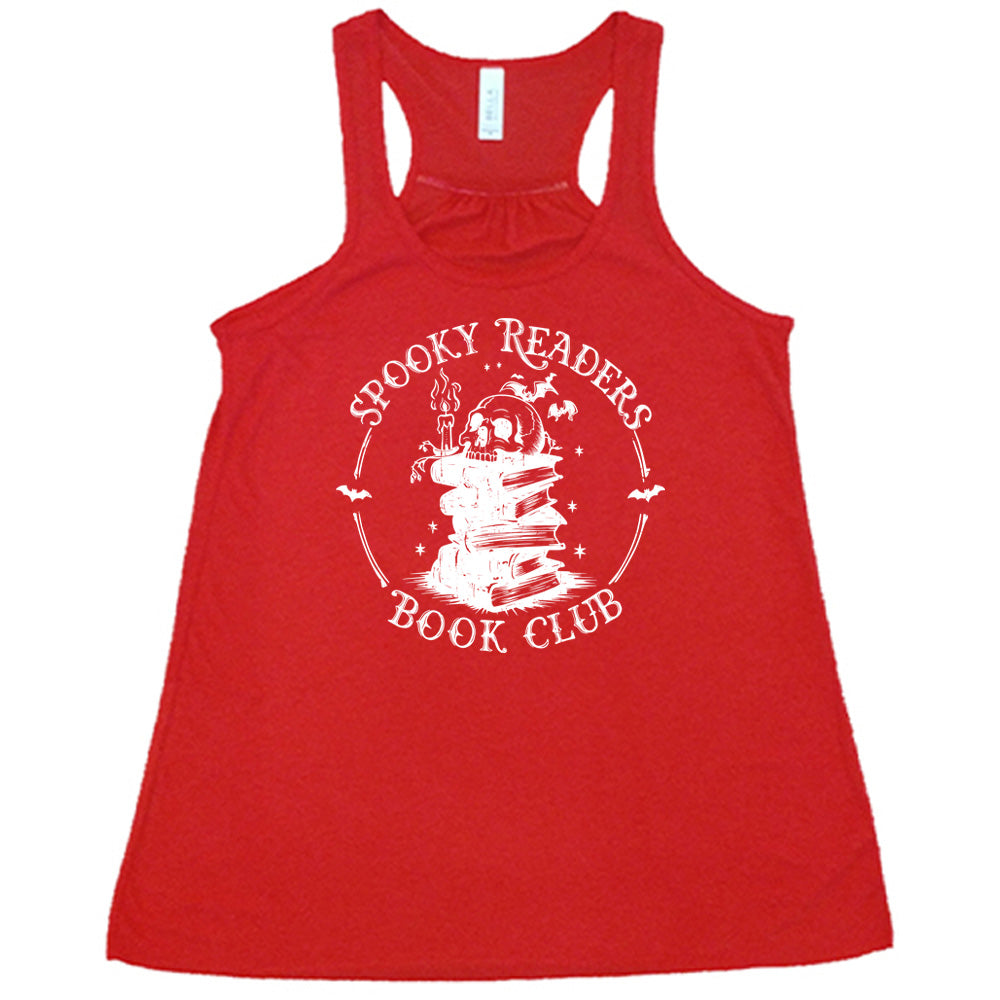 Red colored flowy tank with skull on a stack of books graphic on it that says "Spooky Readers Book Club"