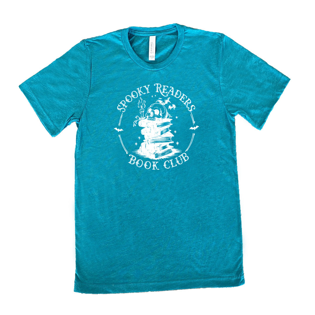 Teal colored shirt with skull on a stack of books graphic on it that says "Spooky Readers Book Club"