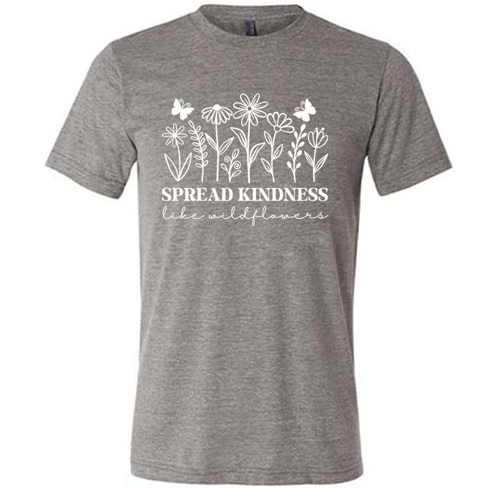 grey unisex tee with the graphics of wildflowers in a row, with the words "spread kindness like wildflowers" written underneath