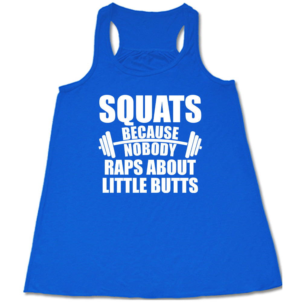 blue flowy tank with the words "squats because nobody raps about little butts" in all caps with a graphic of a barbell between the words "because" and "nobody"
