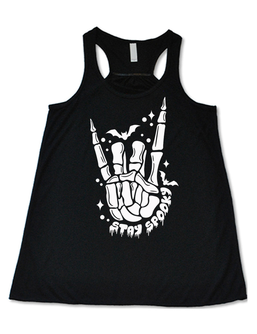 black flowy racerback tank with the large graphic of a rocker skeletal hand, with two little bats, and few stars and dots, with the words underneath saying "stay spooky"