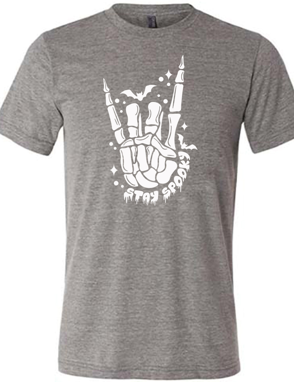 grey unisex tee with the large graphic of a rocker skeletal hand, with two little bats, and few stars and dots, with the words underneath saying "stay spooky"