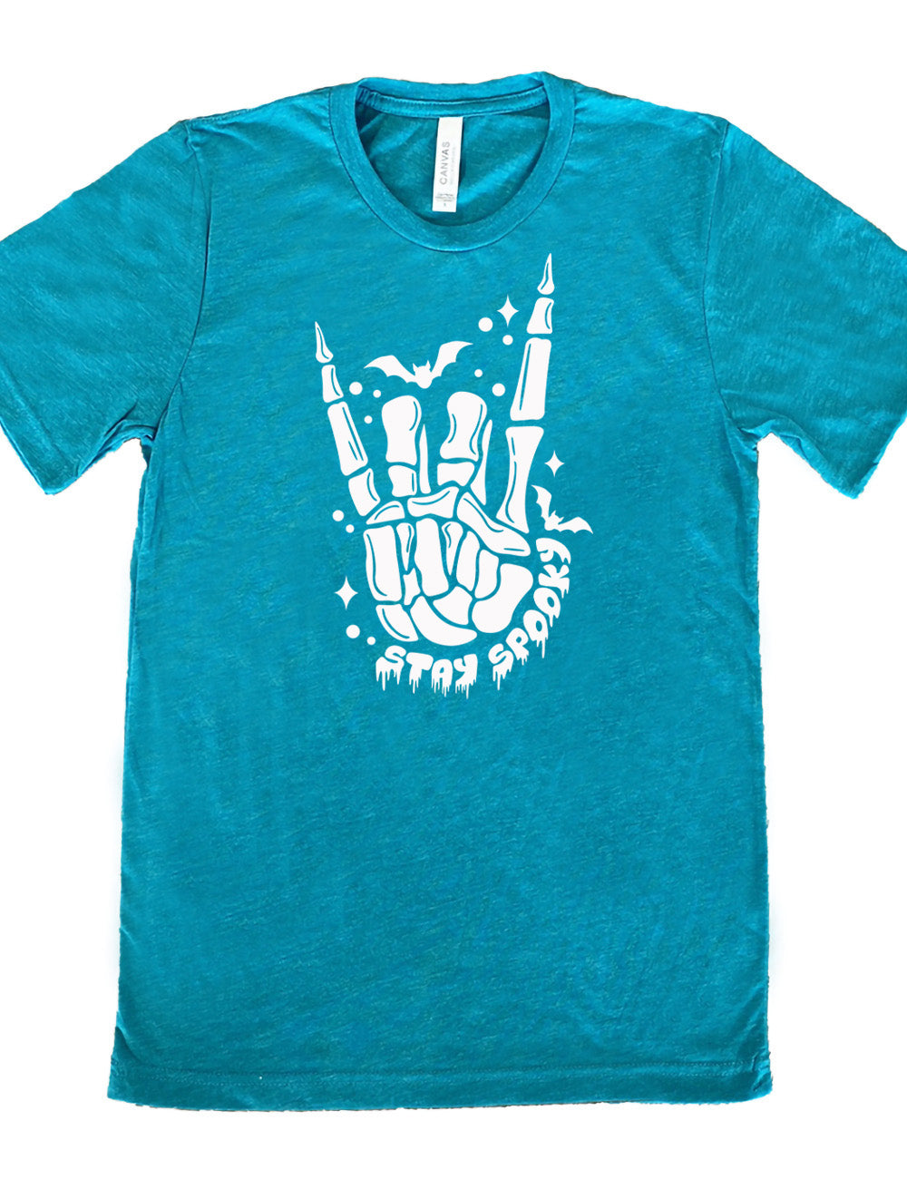 teal unisex tee with the large graphic of a rocker skeletal hand, with two little bats, and few stars and dots, with the words underneath saying "stay spooky"