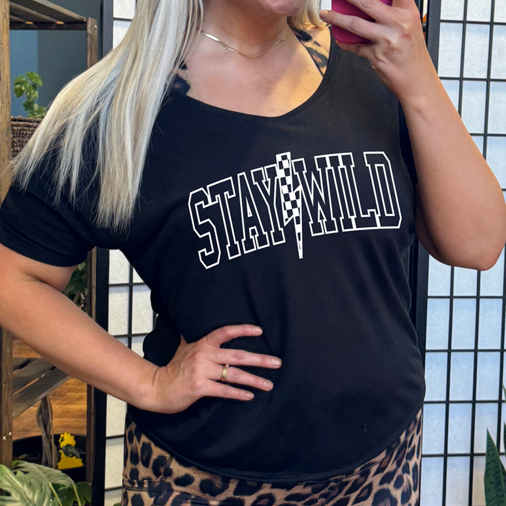 shirt with a checkered lightning strike graphic on it that says "Stay Wild"