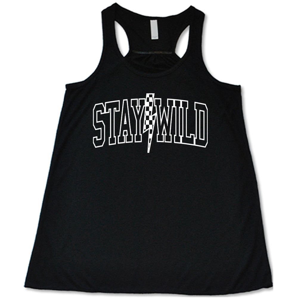 Black colored flowy tank with a checkered lightning strike graphic on it that says "Stay Wild" 