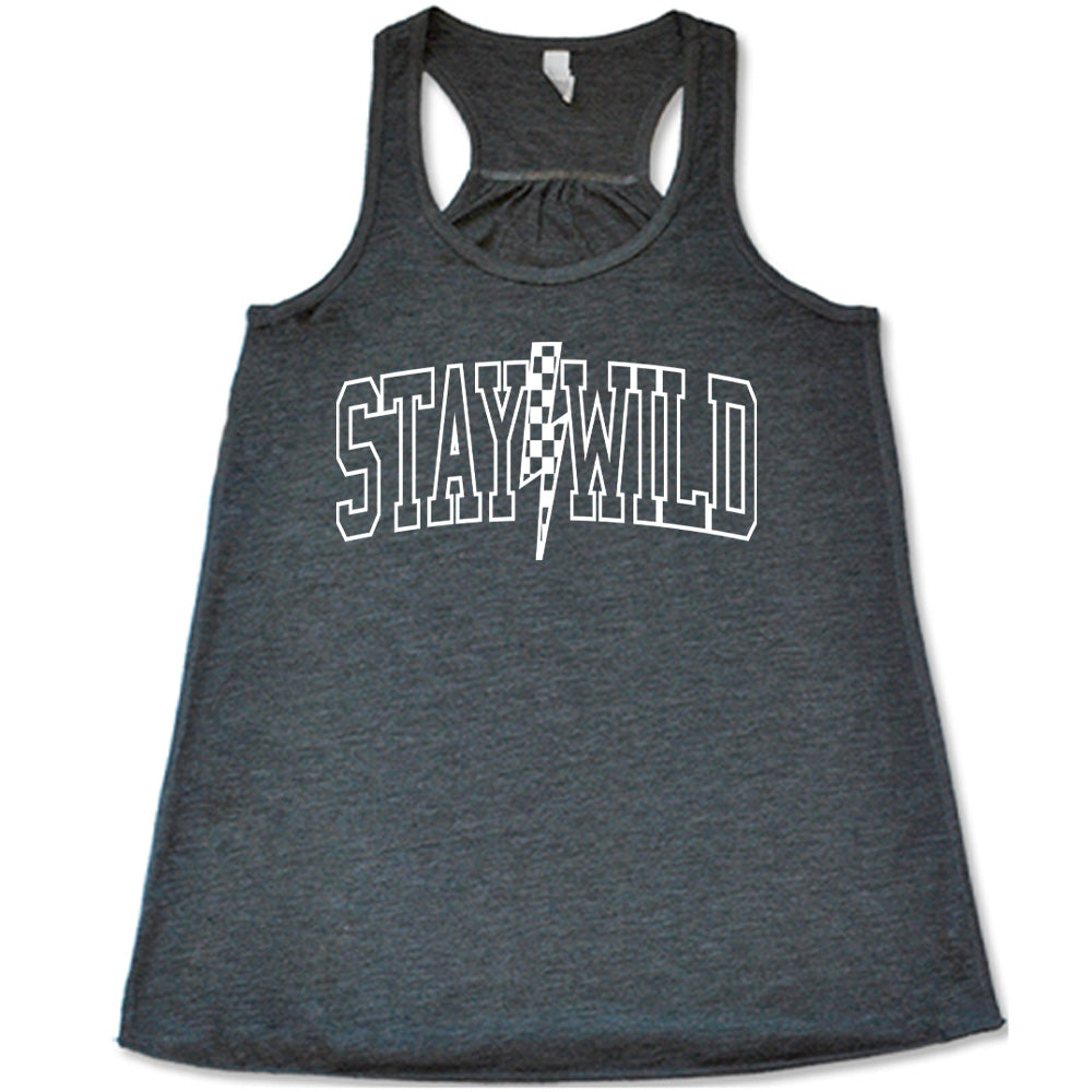 Grey colored flowy tank with a checkered lightning strike graphic on it that says "Stay Wild" 