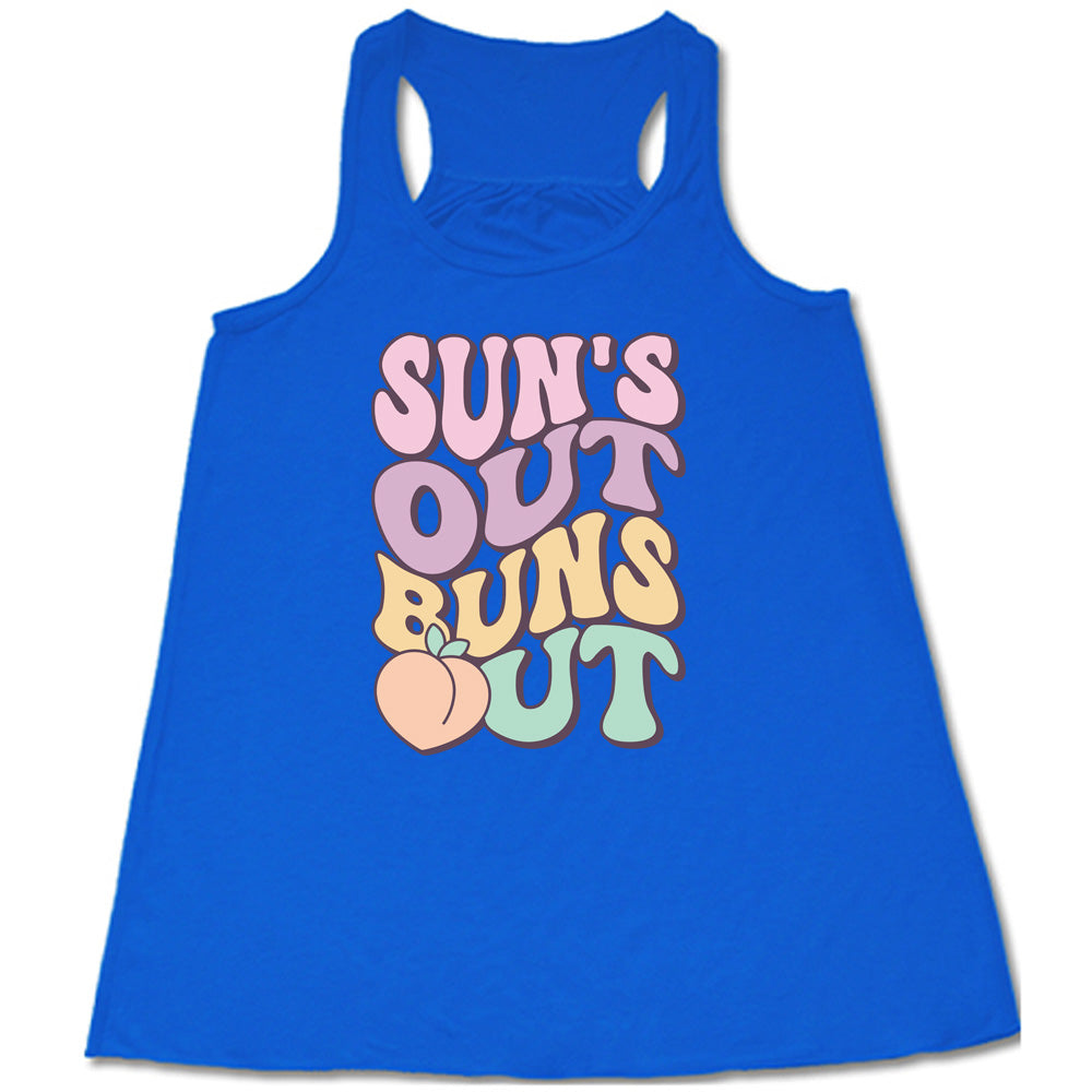 Blue colored flowy tank with a peach graphic on it that says "Suns Out Buns Out" 