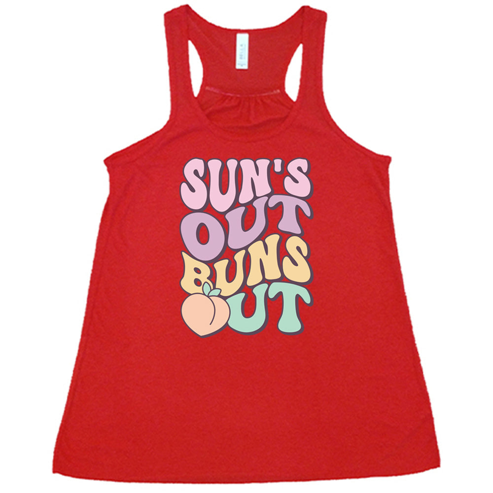 Red colored flowy tank with a peach graphic on it that says "Suns Out Buns Out" 