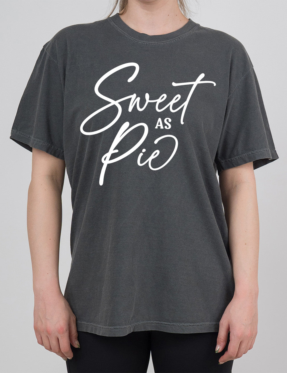 pepper modern tee with the words, in mostly sweeping cursive, saying "sweet as pie"