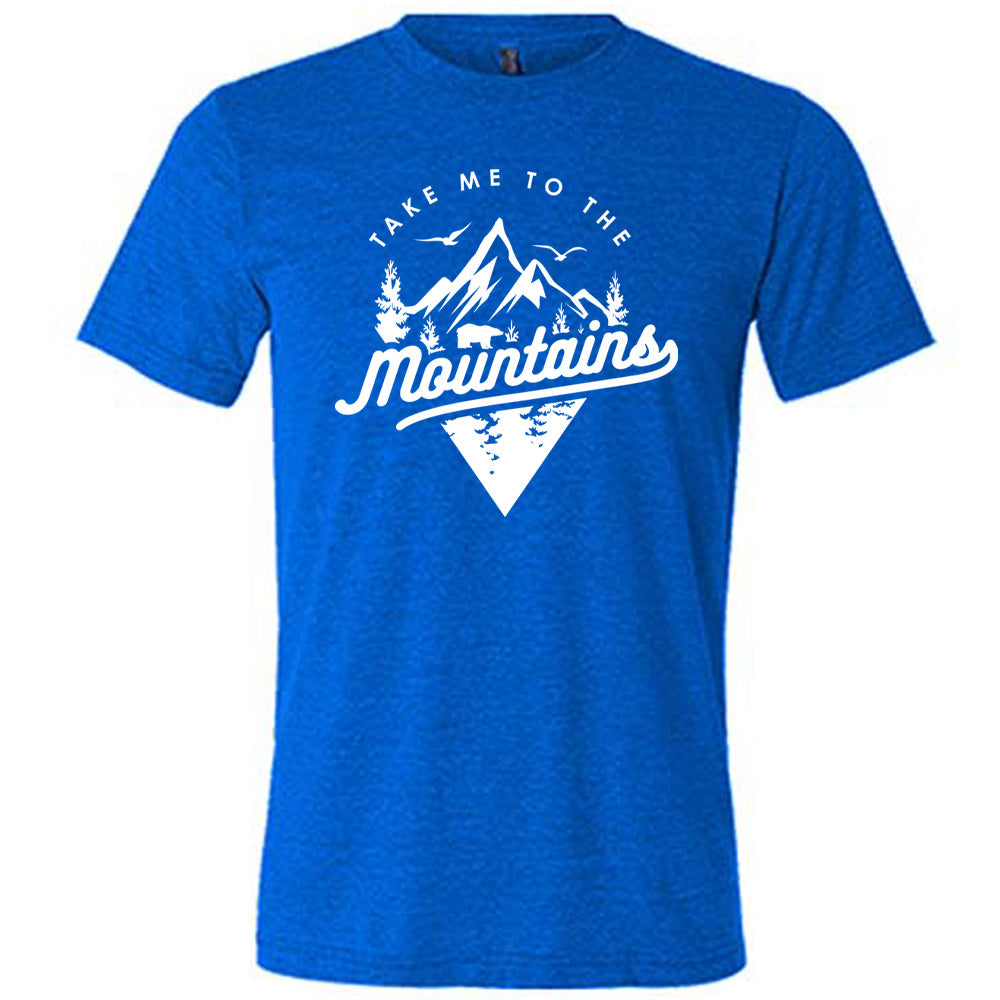 Blue colored shirt with a mountains graphic on it that says "Take Me To The Mountains" 