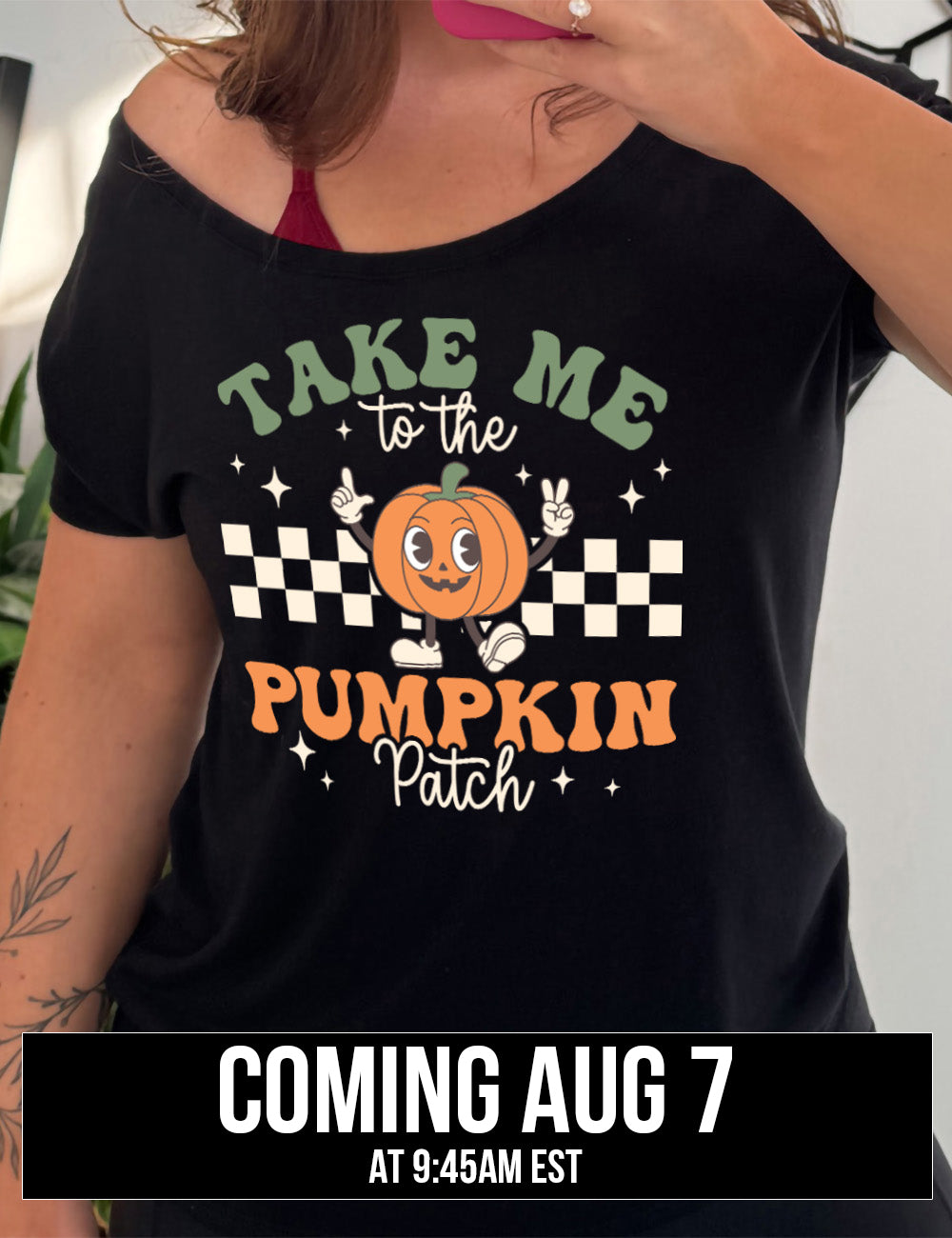 black slouchy tee with the retro design of a pumpkin with arms raised, foot kicked out, in front of a checkered panel, with a few stars around, and the words above and below saying "Take me to the pumpkin patch" coming august 7th