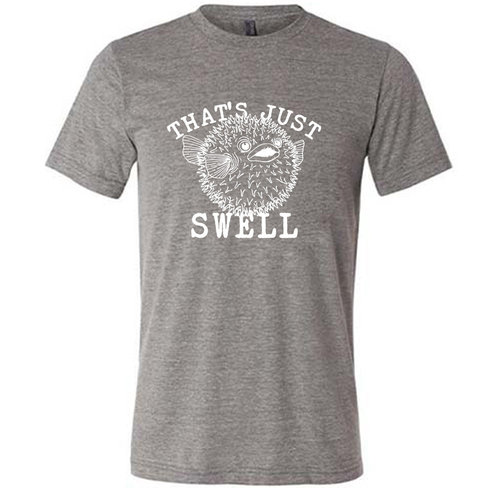 Grey colored shirt with a pufferfish graphic on it that says "That's Just Swell" 