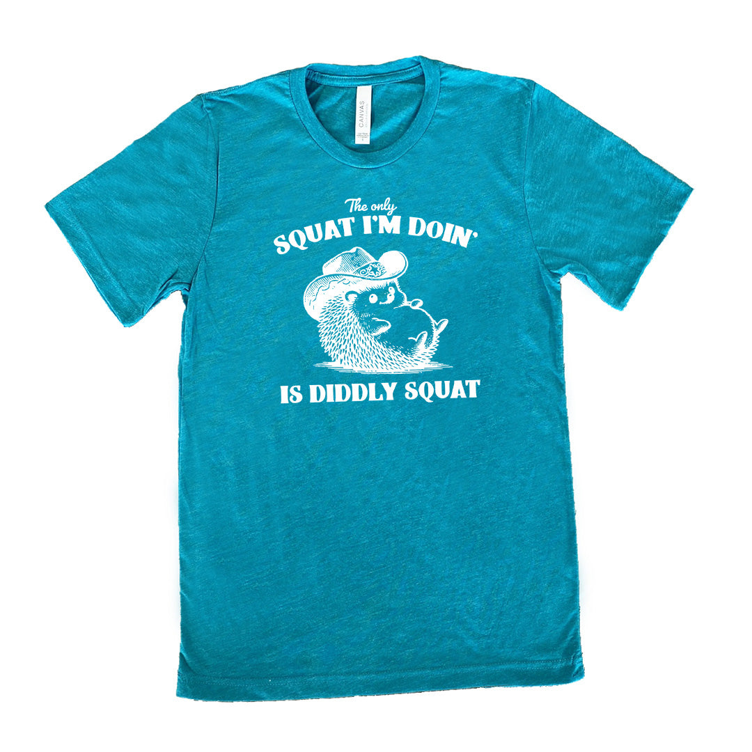 Teal colored shirt with a porcupine in a cowboy hat graphic on it that says "The Only Squat I'm Doing Is Diddly Squat"