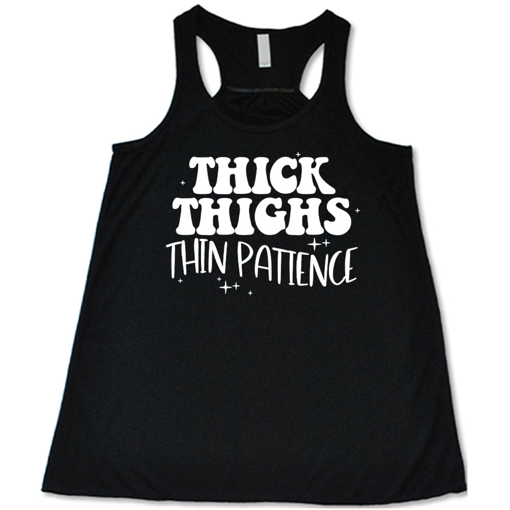 Black Flowy Tank with Thick Thighs Thin Patience in white lettering, with little stars