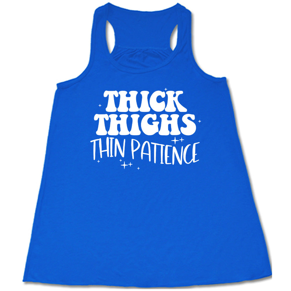 Blue Flowy Tank with Thick Thighs Thin Patience in white lettering, with little stars