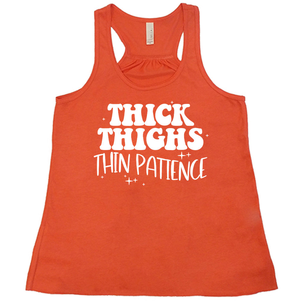 Coral Flowy Tank with Thick Thighs Thin Patience in white lettering, with little stars