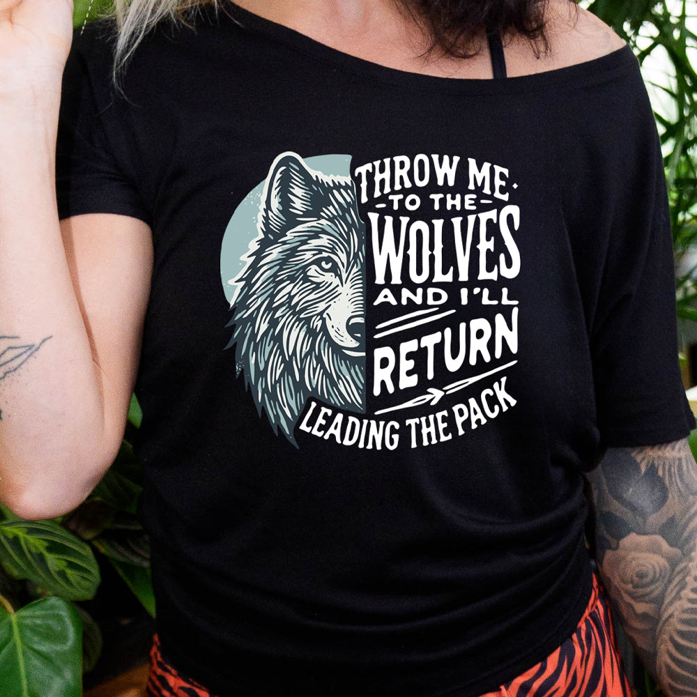 shirt with a wolf face graphic on it that says "Throw Me To The Wolves And I'll Return Leading the Pack" 