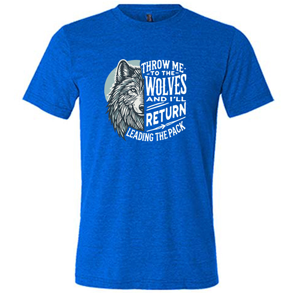 Blue colored shirt with a wolf face graphic on it that says "Throw Me To The Wolves And I'll Return Leading the Pack" 