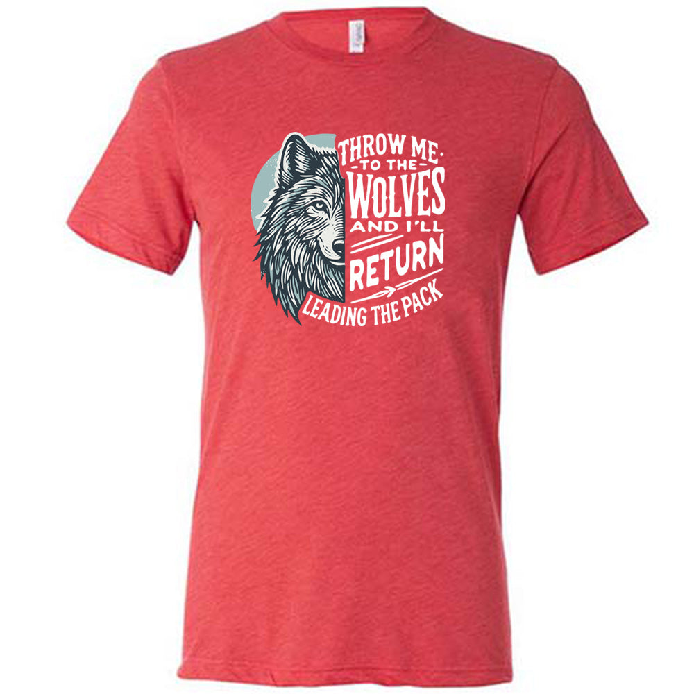 Red colored shirt with a wolf face graphic on it that says "Throw Me To The Wolves And I'll Return Leading the Pack" 