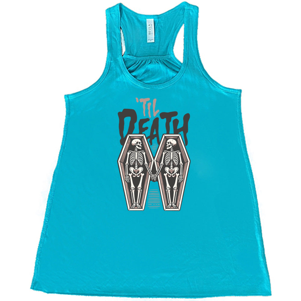 teal flowy tank with the words "'til death" on it, with graphics of two skeletons, both in their own coffins, holding hands in the middle