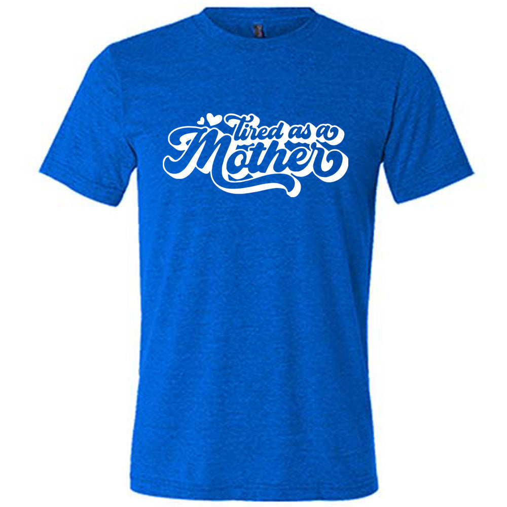 blue unisex tee with the words "tired as a mother' on it, with a couple little hearts at the start