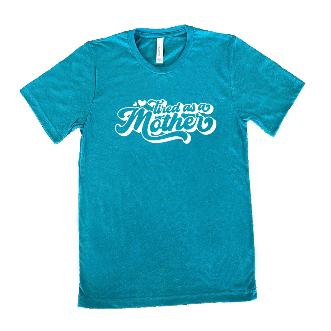teal unisex tee with the words "tired as a mother' on it, with a couple little hearts at the start