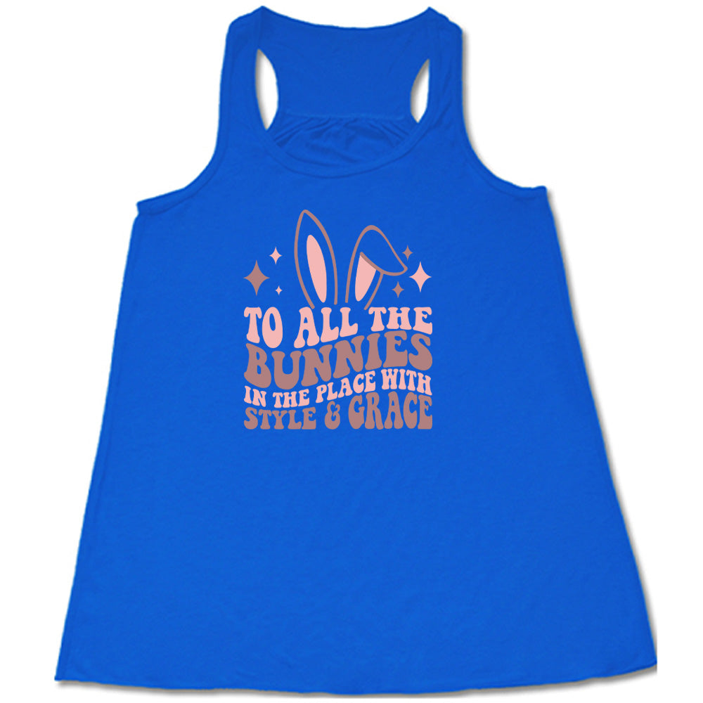 Blue colored flowy tank with a bunny ear graphic on it that says "To All The Bunnies in the Place with Style and Grace" 