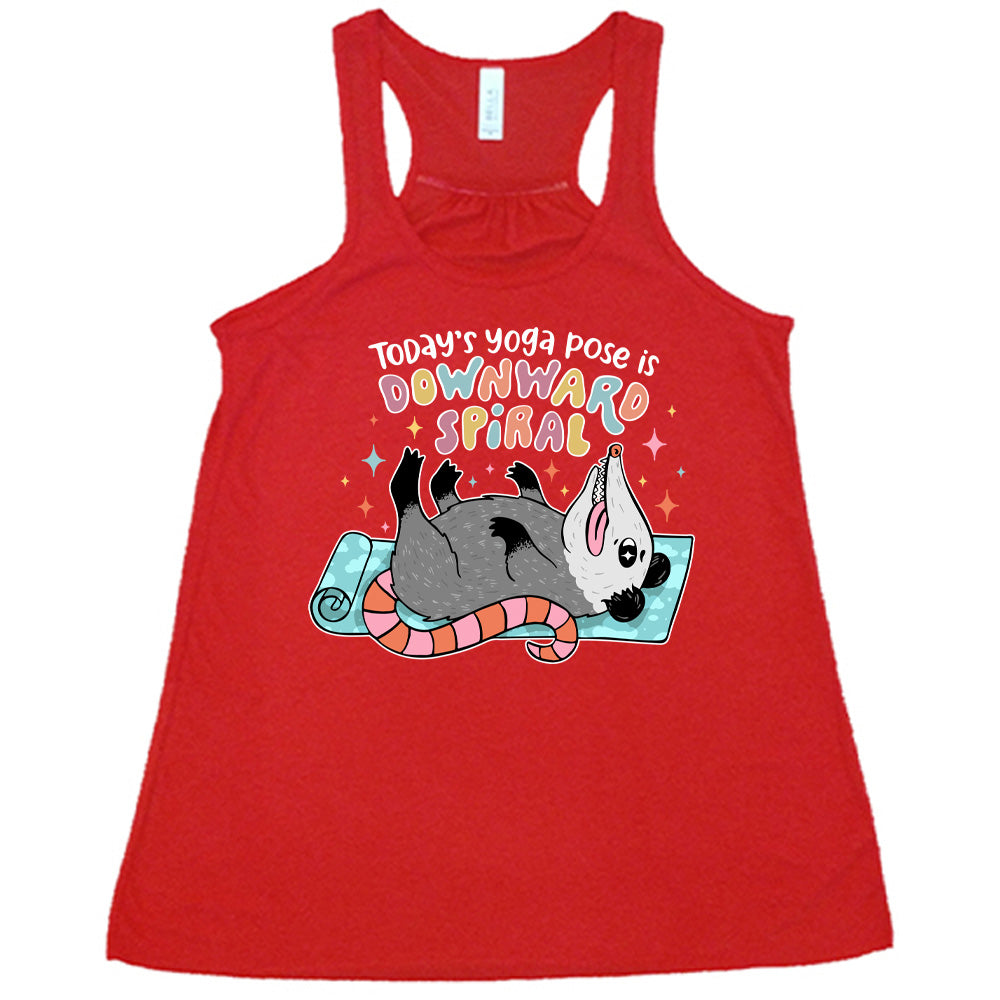 red flowy tank with the words "Today's yoga pose is a downward spiral" and the graphic of a possum playing dead on a yoga mat