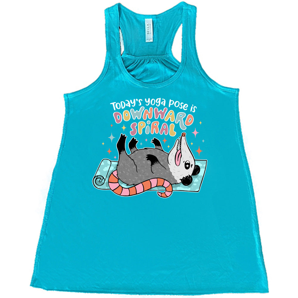 teal flowy tank with the words "Today's yoga pose is a downward spiral" and the graphic of a possum playing dead on a yoga mat
