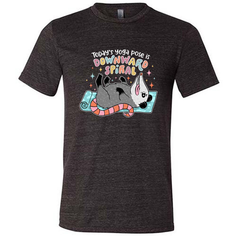 Black unisex tee with the words "Today's yoga pose is a downward spiral" and the graphic of a possum playing dead on a yoga mat