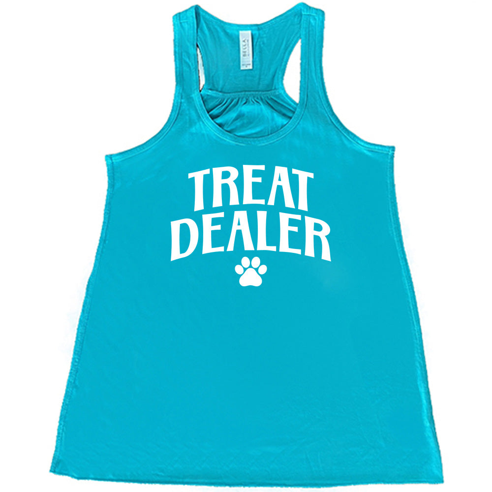 Teal colored flowy tank with paw print graphic on it that says "TREAT DEALER"