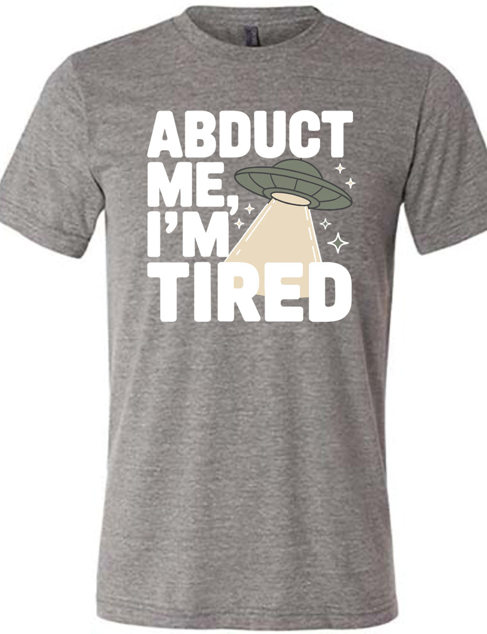 grey unisex tee with the words "abduct me, I'm tired" on it, with a graphic of an alien spaceship, with a beam extended, and a few little stars