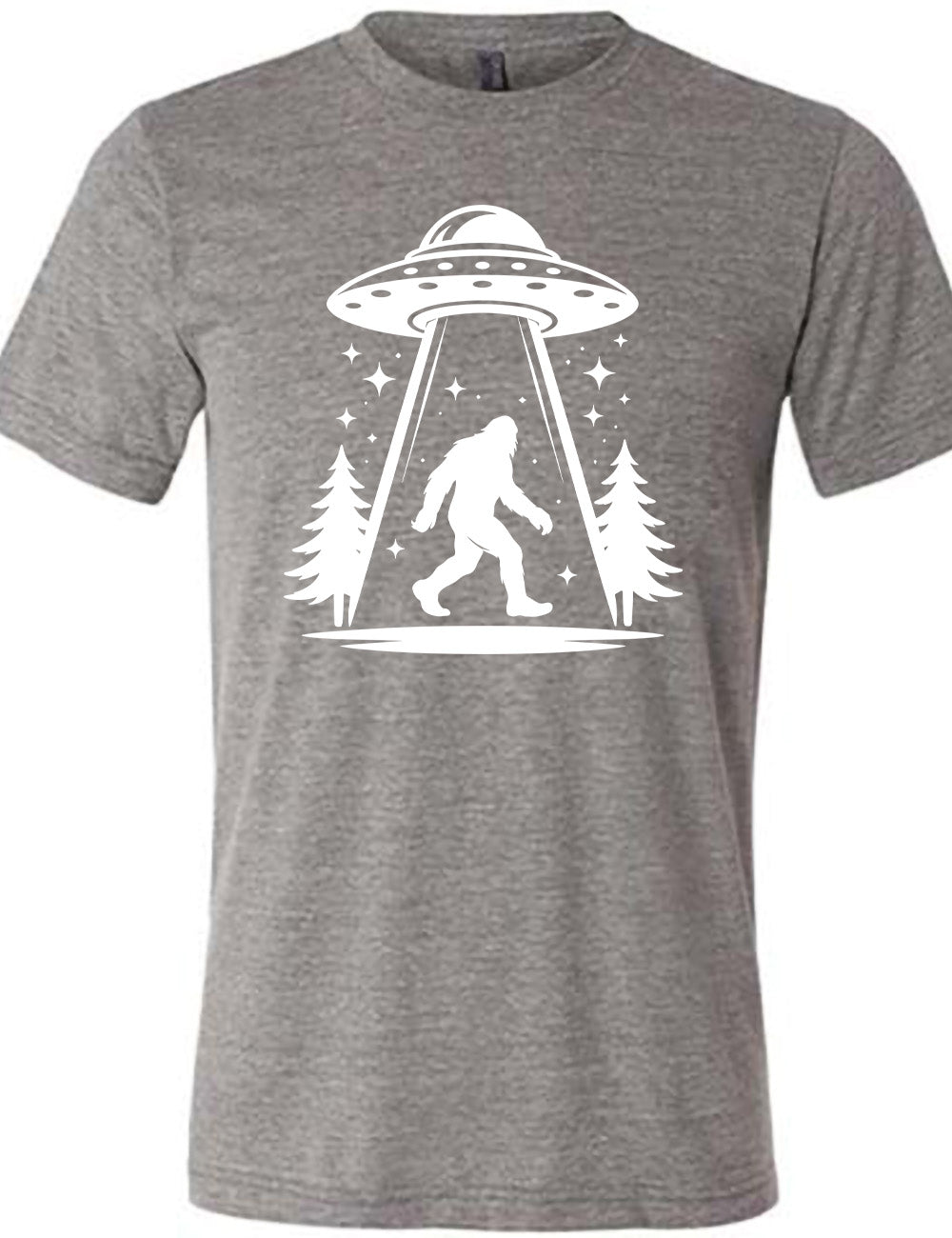 grey unisex tee with the graphic of an alien spaceship beaming bigfoot up, with stars surrounding, and couple pine trees
