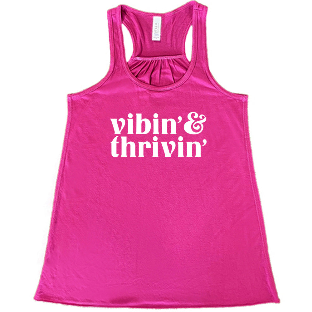 berry shirt with the text "Vibin & Thrivin" on it