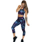 model wearing capri length purple and blue skull and butterfly leggings and matching sports bra