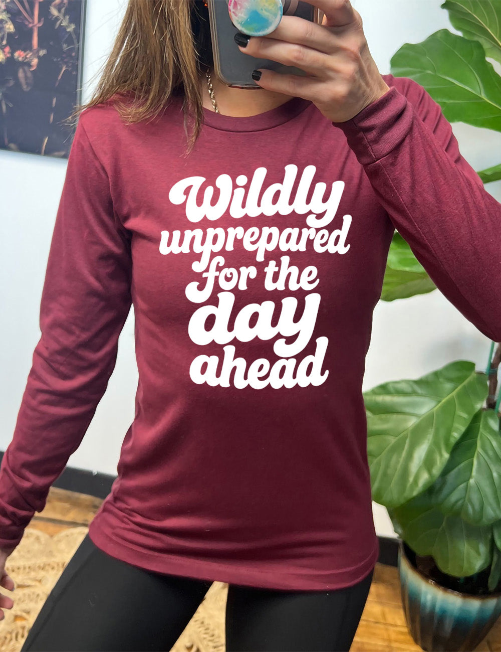 heather cardinal long sleeve tee with words on it saying "Wildly unprepared for the day ahead"