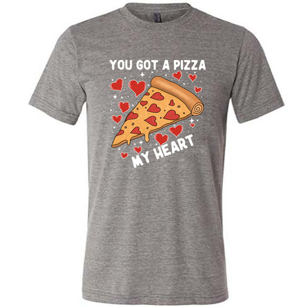 grey unisex tee with the words "you got a pizza my heart" on it, with a big graphic of a pizza with pepperoni hearts, and hearts surrounding it as well with little stars