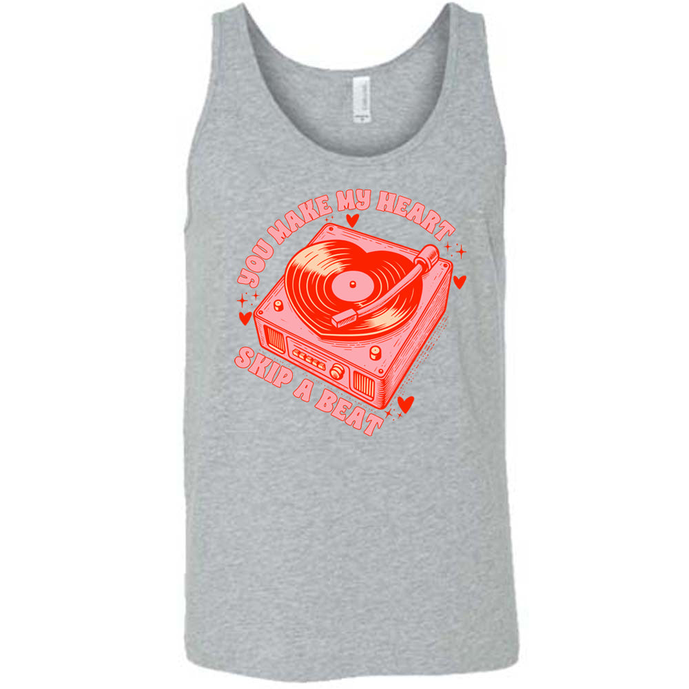 grey unisex tank with the words "you make my heart skip a beat" on it, with the graphics of a record player, with a record shaped like a heart, with a little hearts and stars around each corner of the player